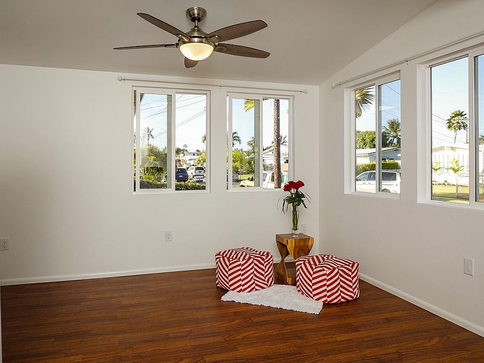 Airy living room with a ceiling fan, recessed lighting and never ending tradewinds.