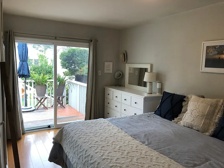 2nd bedroom with patio door to deck
