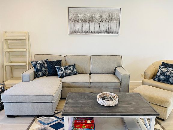 Comfortable living area with plenty of space! Play Monopoly, poker, or other board games since they are all provided.