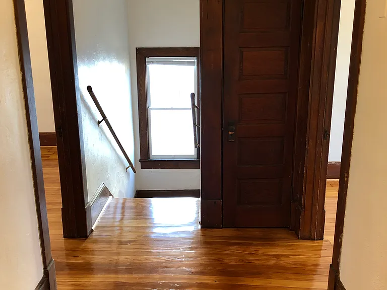 Hallway facing stairs