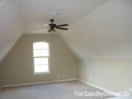 Bonus facing front of house with .5 bath