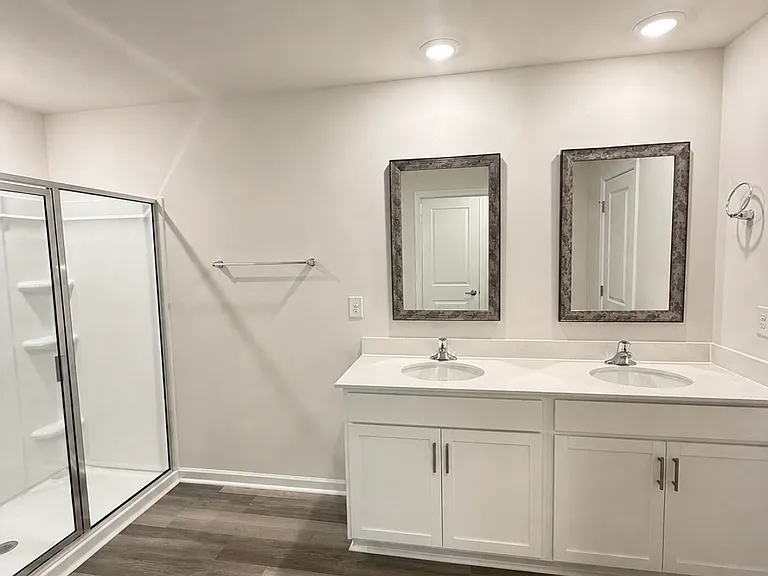 Master bathroom features double sink, 2 closets and stand up shower