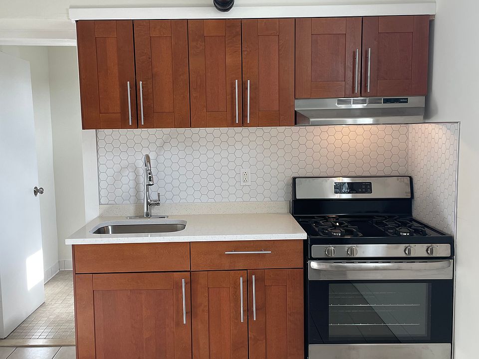 Quartz countertop, new sink faucet, new stainless appliances.