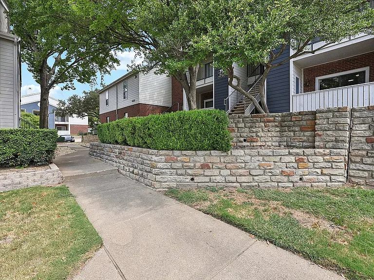 Stylish apartment building exterior at Collin Creek Apartments, located in the heart of Plano.