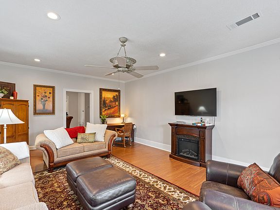 living room with corner work station