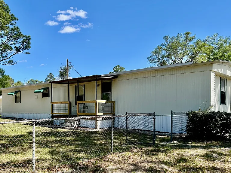 Front of mobile home facing pasture