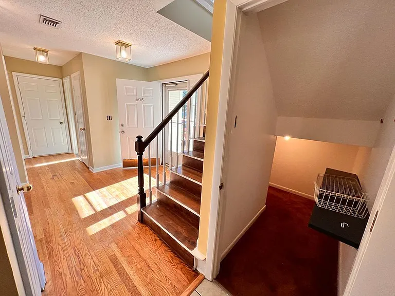 walk in closet next to kitchen