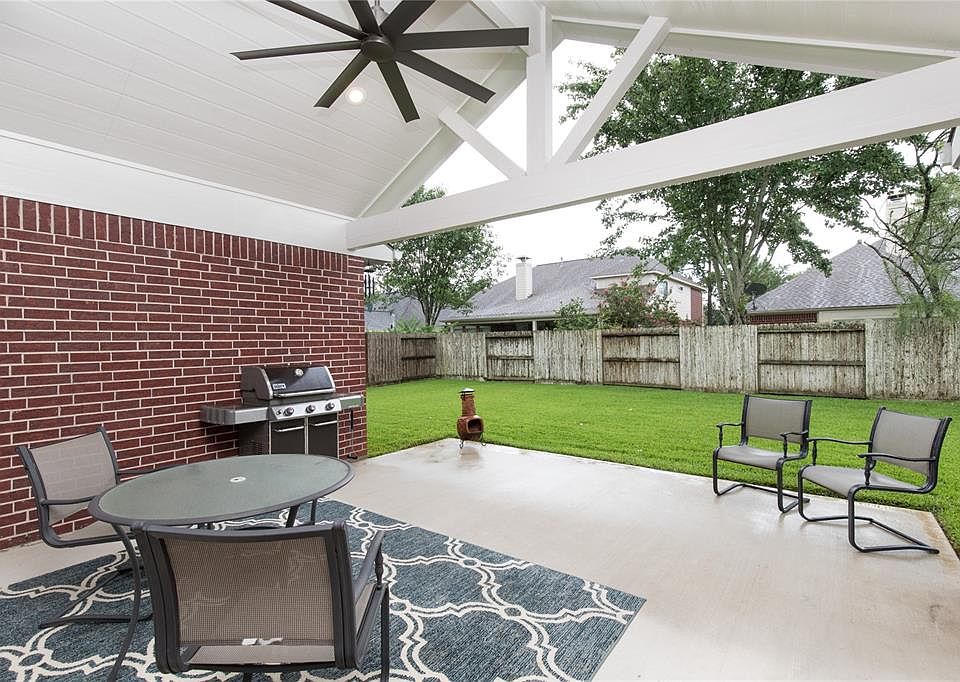 RECENTLY ADDED EXTENDED COVERED BACK PATIO WITH CANNED LIGHTS AND CEILING FAN.