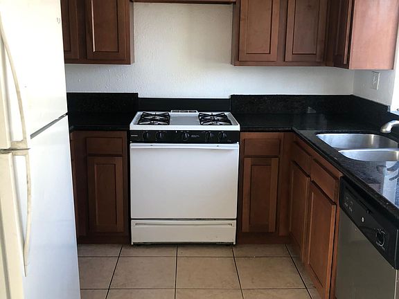 New Kitchen cabinets, granite countertops, gas stove, stainless stove and dishwasher, recessed lighting