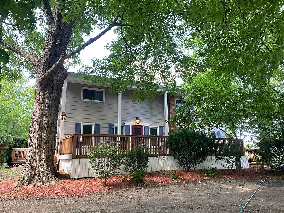 Front of house. New lawn about to be installed. Three porch lights on to show them.