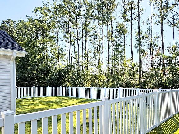 White picket fence back yard