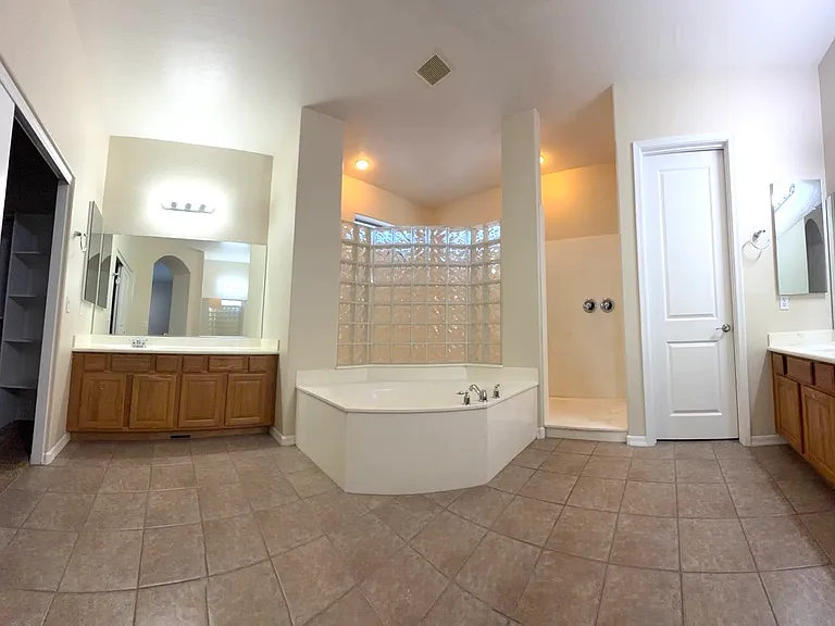 Master Bath with dual vanities and Walk In Shower w/2 Shower Heads