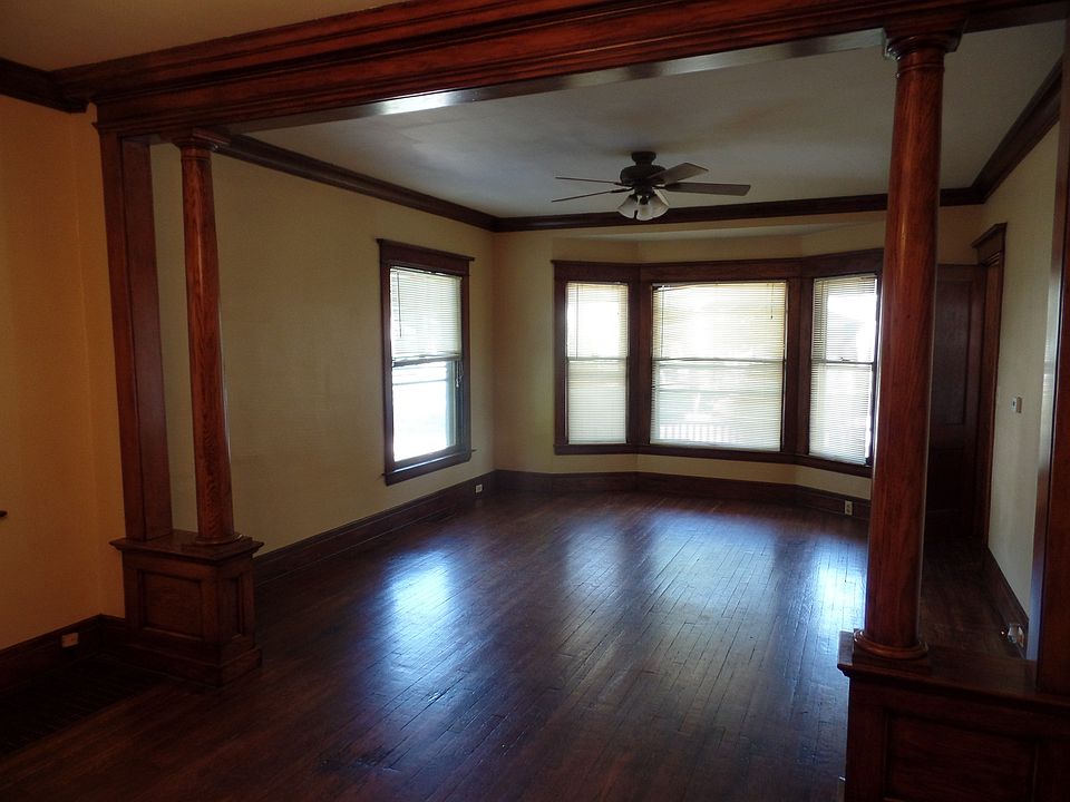 Living room hardwood floors and bay window