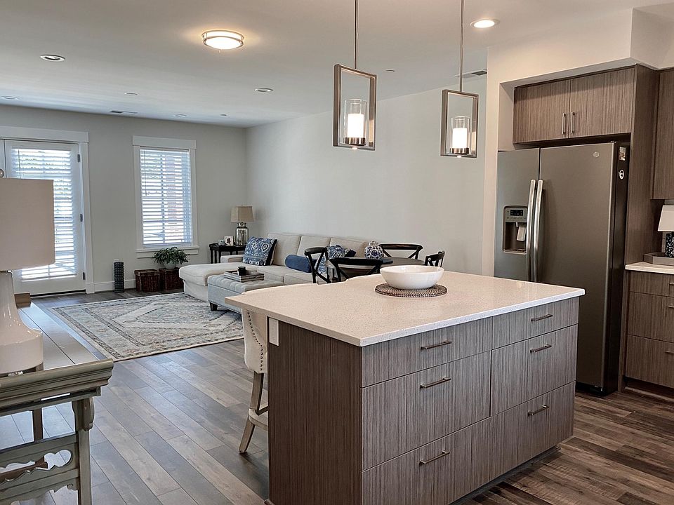 Lower level: open kitchen, living, dining space.