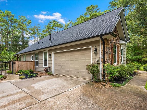 2 car garage with opener and storage space