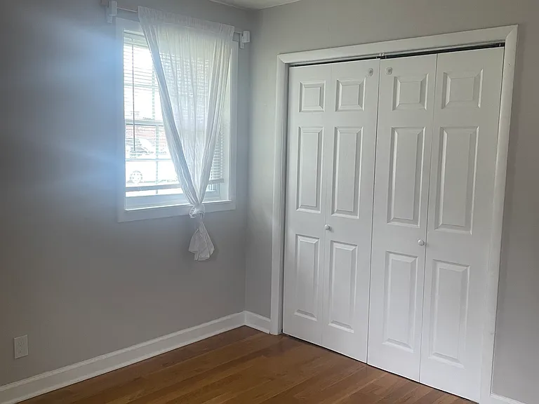 Front bedroom with a ceiling fan.