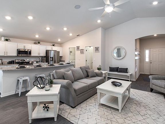 Spacious and welcoming gathering room - New home for sale in Eagle Lake, FL. Photo showcases the hom