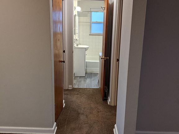 Looking down hall toward bedrooms and bath