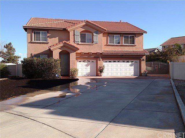 Front View - Long extended driveway and gated RV access