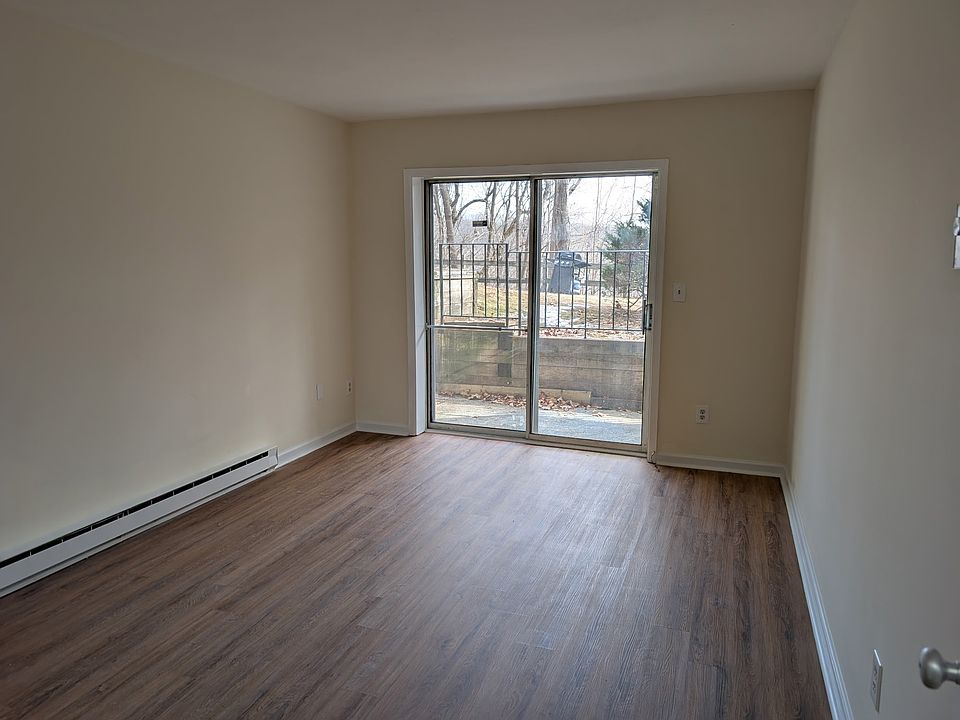 Bedroom with sliding glass door out to patio.