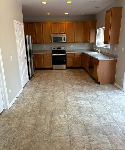 Kitchen dw, pantry, refrigerator, microwave, oven