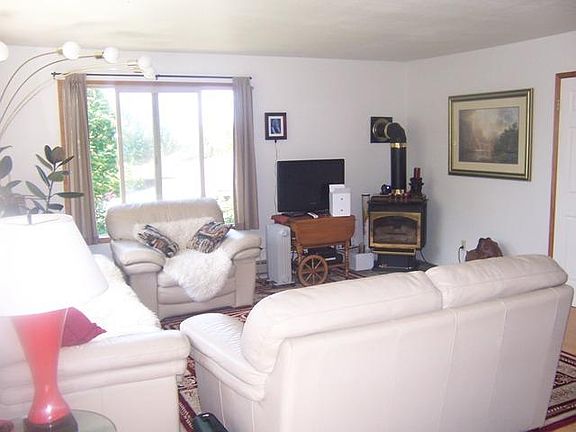 Another view of the living room and fireplace.