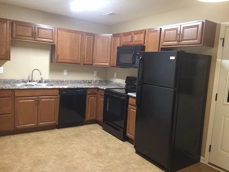 Kitchen with appliances included.