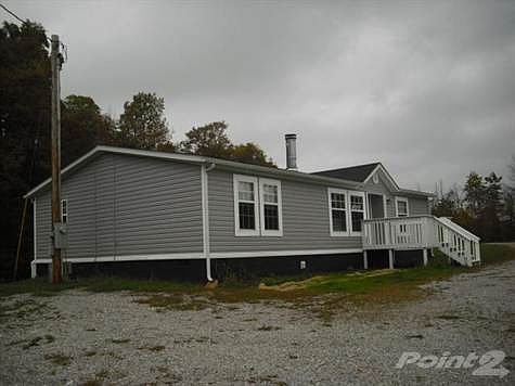 Very pretty double wide located on 0.5 acres with great views and backs to the woods. Beautiful fall color.