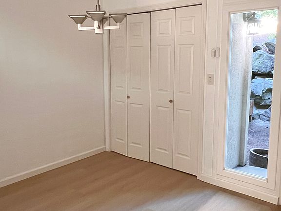 Small dining area next to door, adjacent to kitchen.