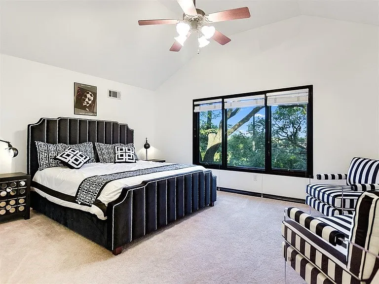 Upstairs Master Bedroom #2 overlooks a tree canopy.