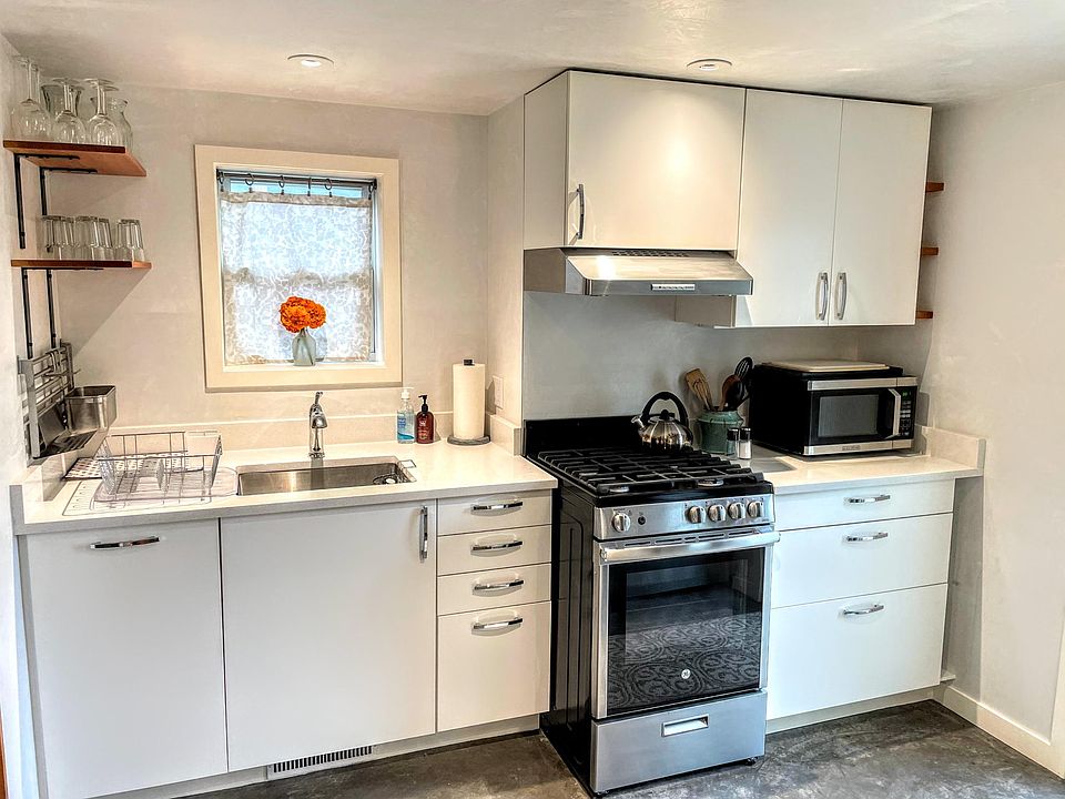 Enjoy cooking in this bright kitchen with gas stove, electric oven, garbage disposal, and plenty of storage.