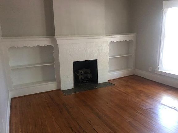 Living Room with Decorative Fireplace and Hardwood Floors
