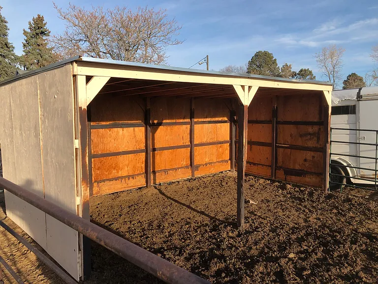 Horse corral loafing shed.