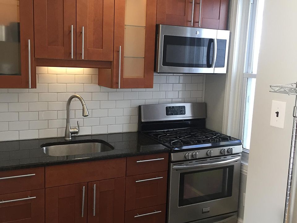 The kitchen was re-done a few years ago. The backsplash is subway tile. There is no dishwasher, but the stove and the microwave above it were replaced a few years ago as well.