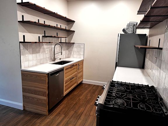 Kitchen with gas stove, dishwasher, and plenty of shelf and cabinet space.
