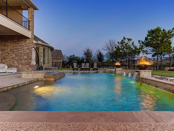 Pool has beautiful water falls, fire features and has an automatic cleaner.