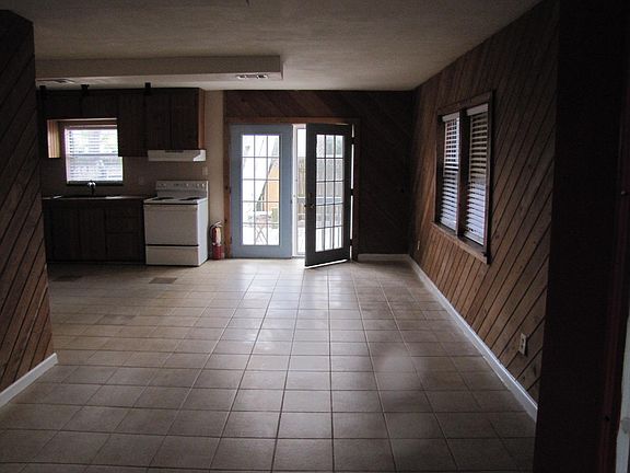 Living, dining, kitchen, door to rear deck.