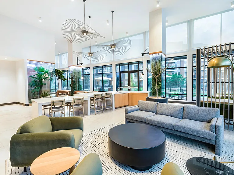 Stylish and inviting lounge space with high ceilings and modern seating_perfect for casual conversation or quiet moments.