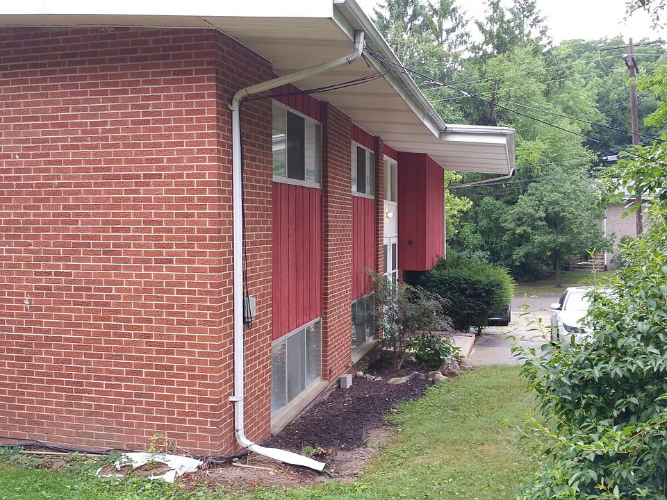 Side entry brick duplex with off-street parking for two cars