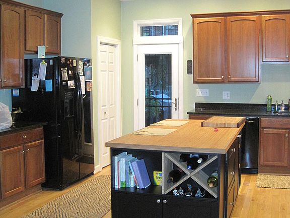 Kitchen with exit to deck and alley