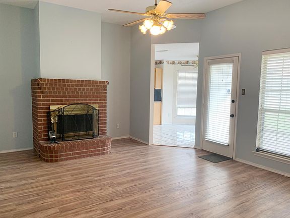 Living space with wood-burning chimney.