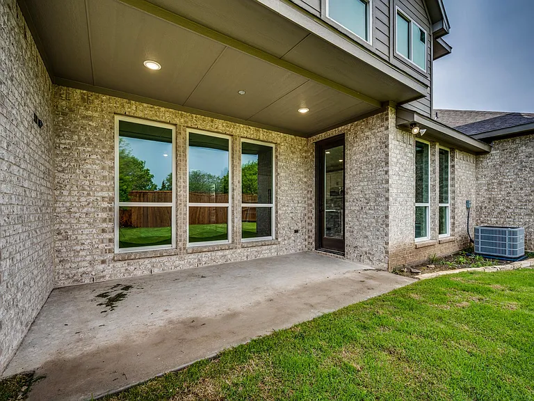 The covered patio is nice to relax and entertain friends.