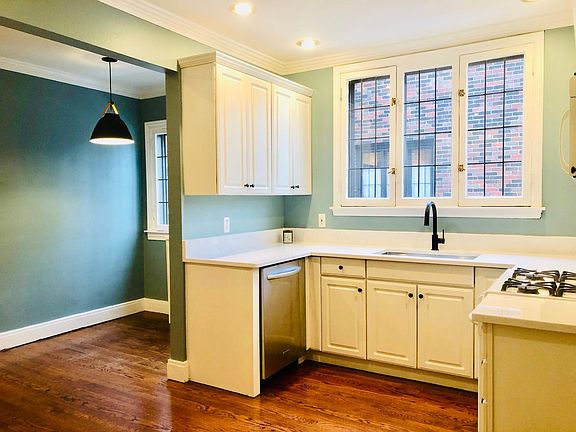 NEWLY UPDATED! Eat in kitchen with microwave, gas stove, new garbage disposal, refrigerator, dishwasher and TWO sinks. Brand new paint, brand new quartz counter tops, brand new sinks and faucets. New kitchen pennant light with leather accents. Original