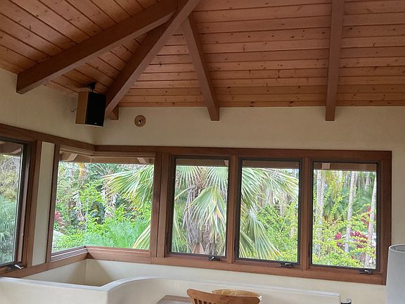 Upstairs bedroom with tall ceiling and sky light