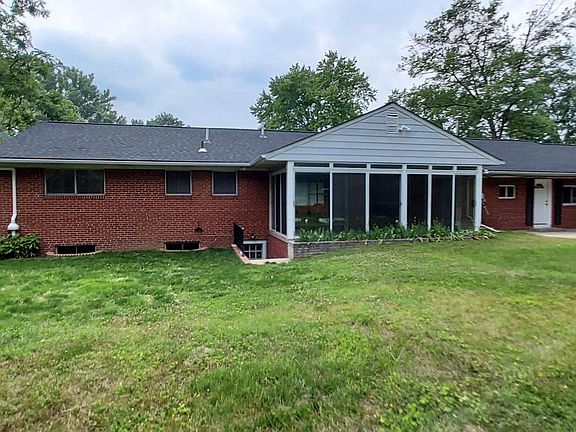 Fenced in back yard with stairwell to the basement