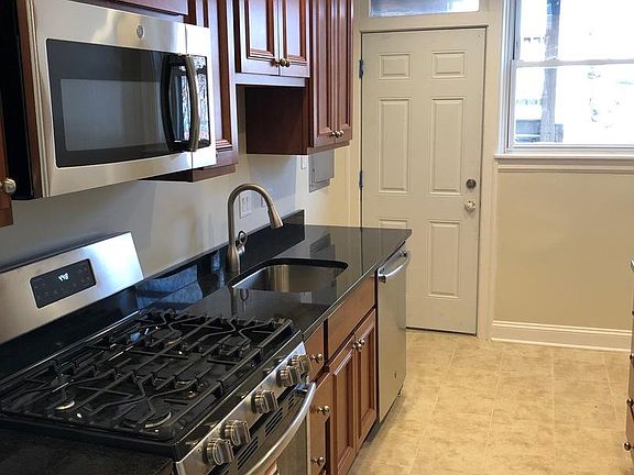Eat-in kitchen with stainless steel appliances