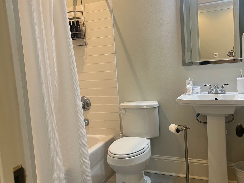 Full bathroom shower and tub. There is a closet in bathroom for towels . there is also a door in hallway that has washer and dryer.