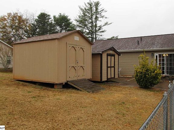 2 storage sheds plus an oversized 2 car garage.