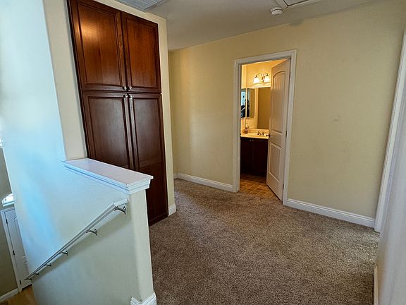Upstairs landing showing attic storage door and 2nd bathroom