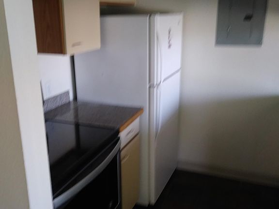 Kitchen with new SS flat cooktop stove